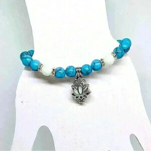 Lotus Pendant Glow in the Dark Beaded Bracelet